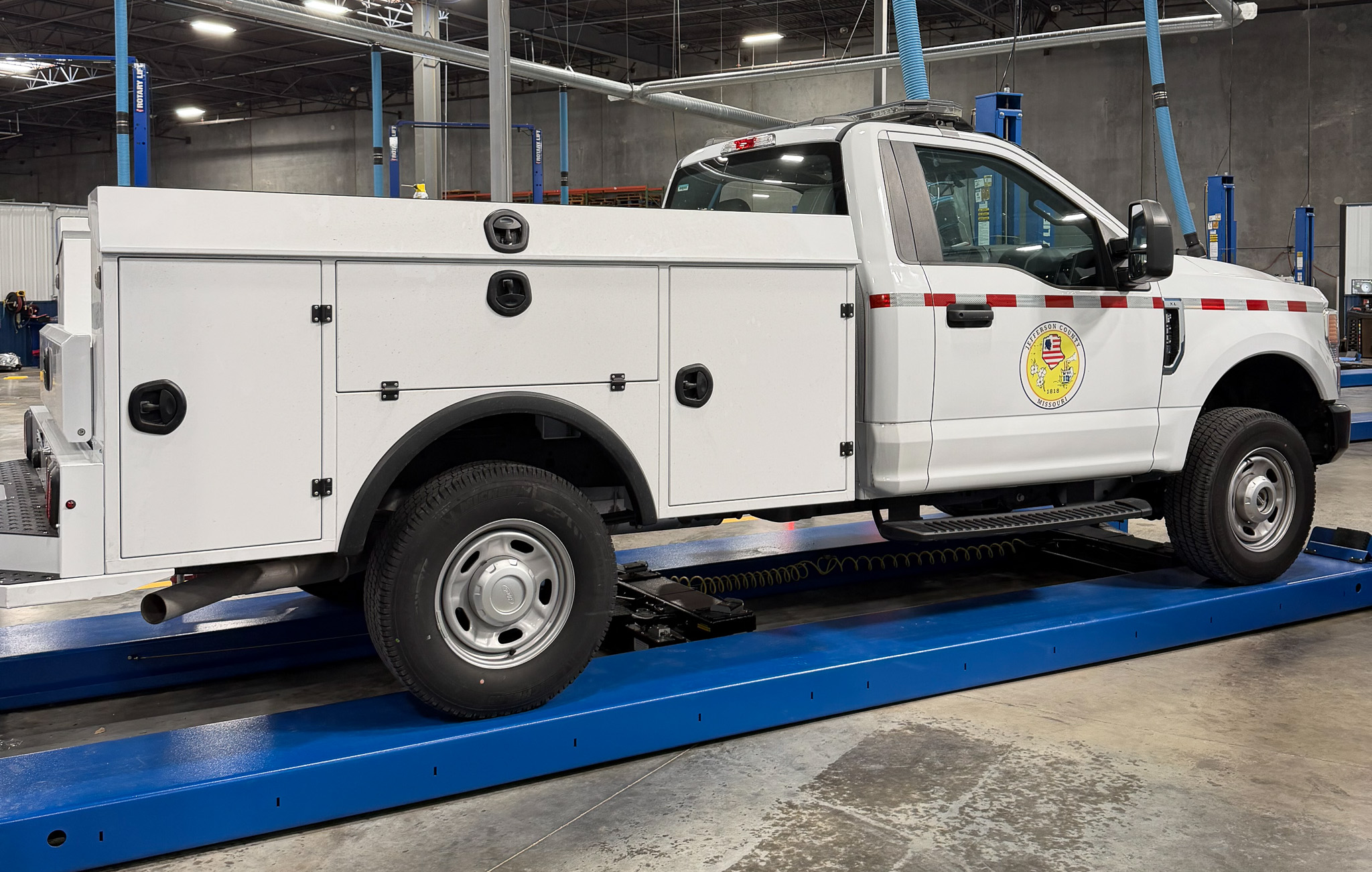 A city utility truck with undergoing uptiffing services.
